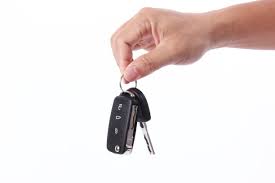 Hand holding car key