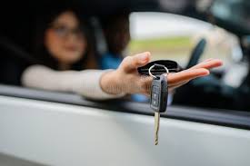 Hand holding car key